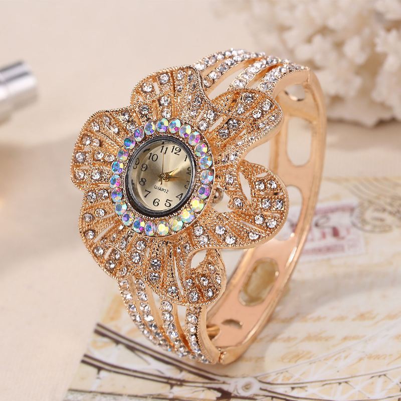 Mode Crystal Blomster Shape Dial Hollow Metal Strap Kvinder Quartz Watch